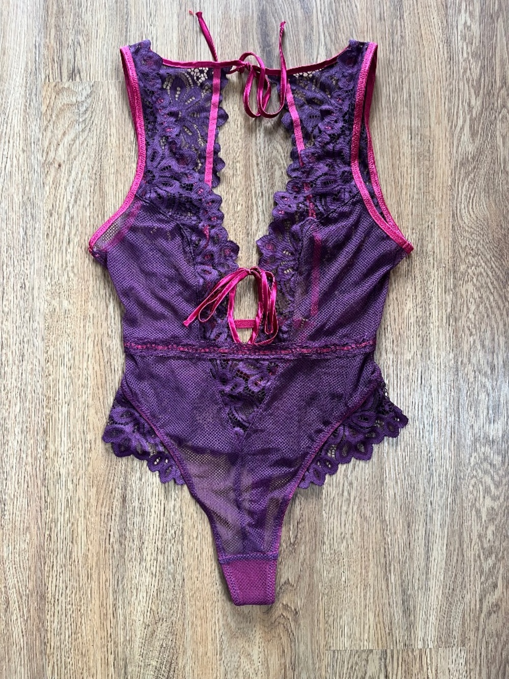 Mentionables purple and pink body suit